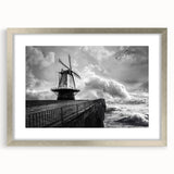 Framed wall art showcasing a serene landscape with windmills, featuring a silver mat and stylish frame, perfect for enhancing home decor aesthetics.