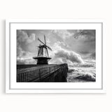 Framed wall art featuring a serene landscape of windmills against a vibrant sunset, with a white mat and frame, perfect for home decor enhancement.