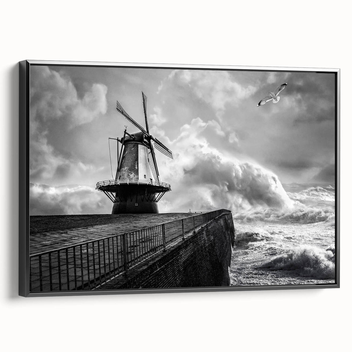 Framed canvas wall art showcasing a picturesque landscape with windmills against a vibrant sunset, featuring a sleek black frame and side view display, ideal for home decor.