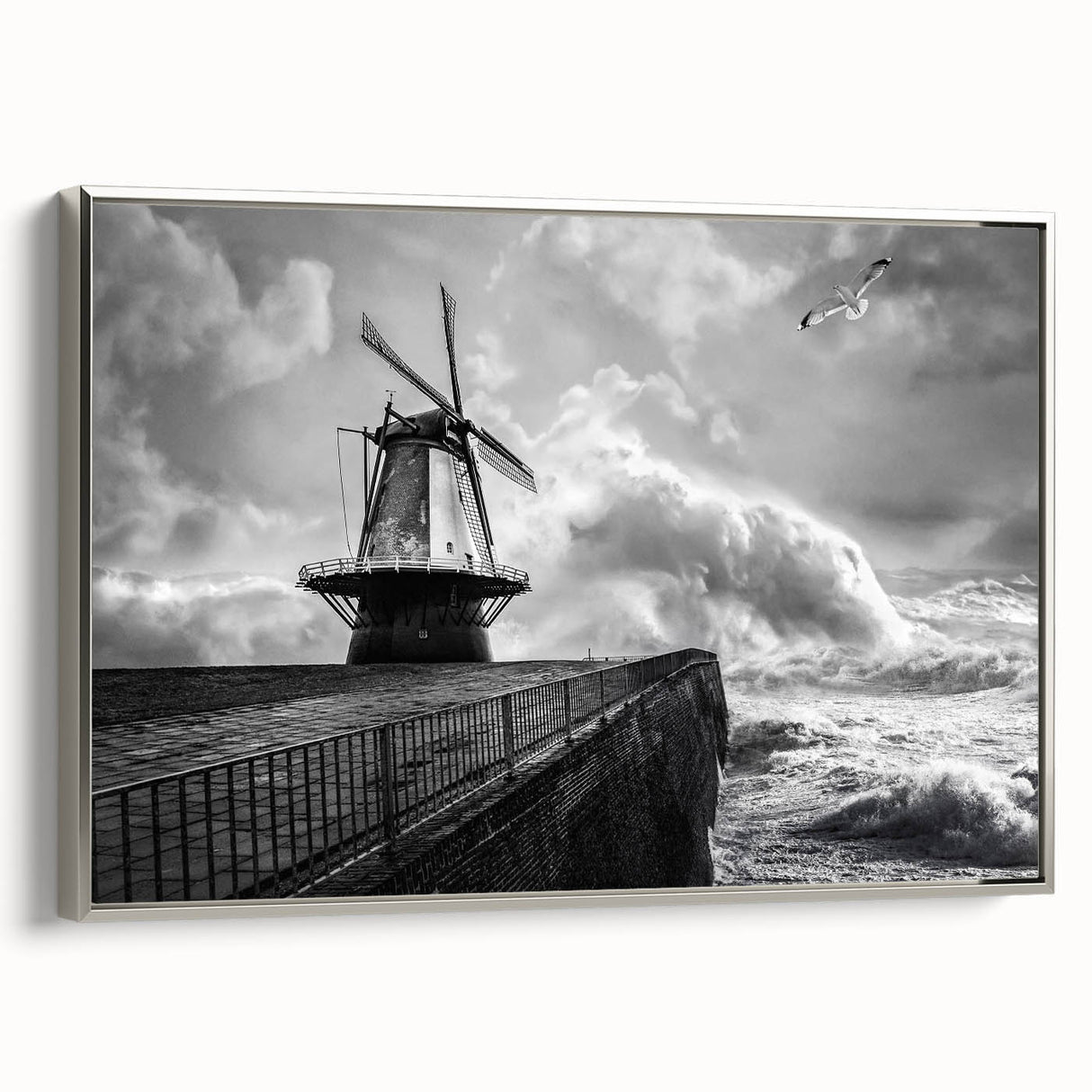 Framed canvas wall art depicting a serene landscape with windmills, featuring a silver frame, ideal for home decor, enhancing modern and rustic interiors.