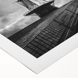 Rolled canvas wall art showcasing a vibrant landscape with windmills, featuring rich colors and detailed imagery, perfect for home decor.