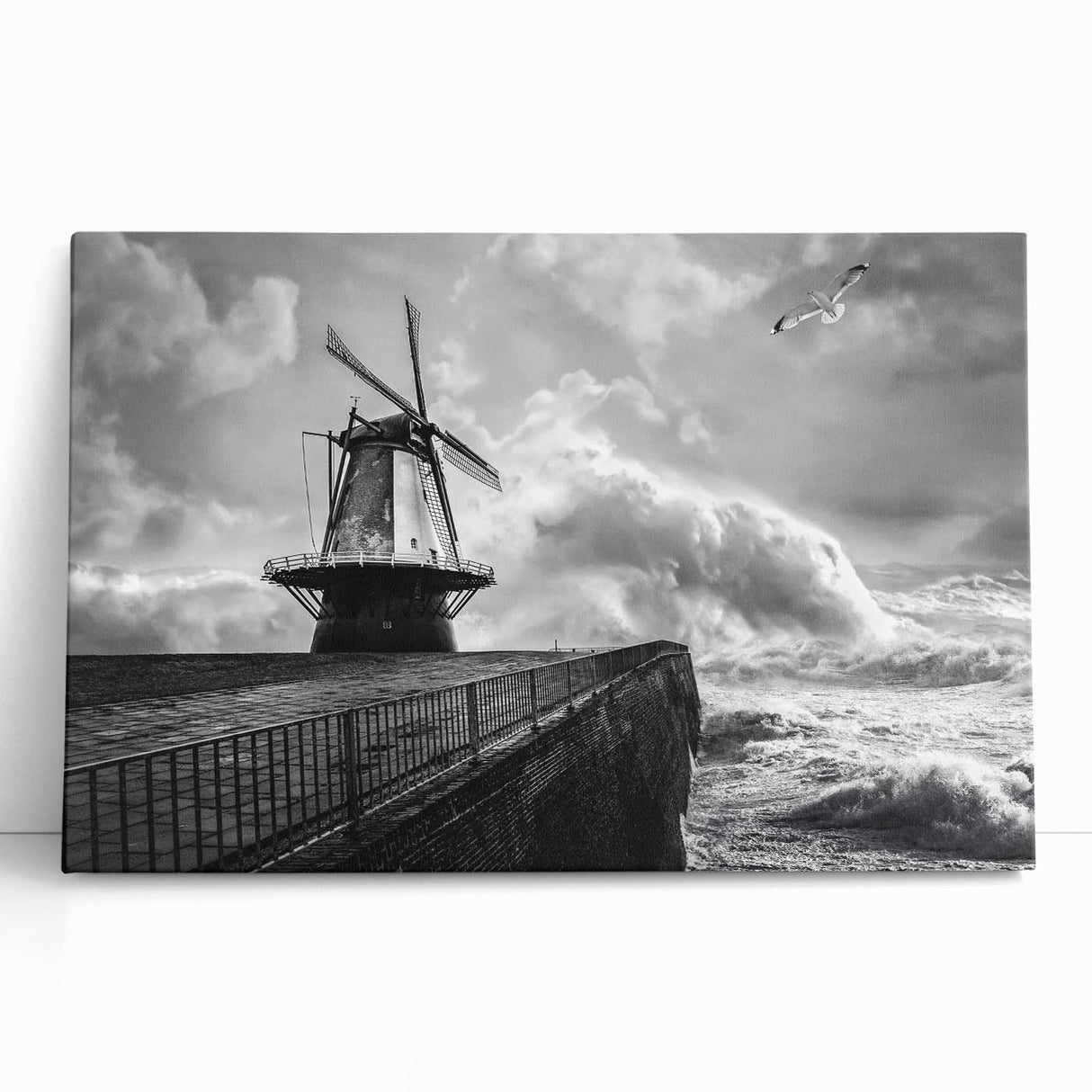 Stretched canvas artwork showcasing a serene landscape with windmills against a vibrant sunset backdrop, ideal for home decor and enhancing living spaces.