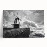 Stretched canvas artwork showcasing a serene landscape with windmills against a vibrant sunset backdrop, ideal for home decor and enhancing living spaces.
