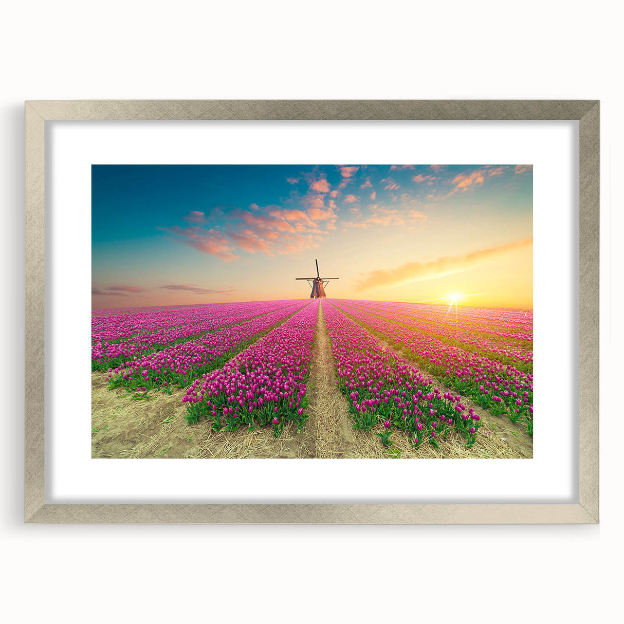 Framed wall art collection showcasing a stunning landscape with windmills, featuring a silver mat. Ideal for modern decor and enhancing home aesthetics.