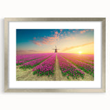 Framed wall art collection showcasing a stunning landscape with windmills, featuring a silver mat. Ideal for modern decor and enhancing home aesthetics.
