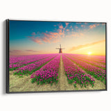 Framed canvas wall art featuring a serene landscape with windmills, showcasing a vibrant sunset scene. The artwork is presented in a sleek black frame, adding a modern touch to home decor. Ideal for enhancing living spaces with its calming colors and natural elements.