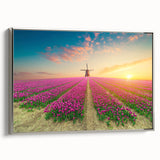 Framed canvas wall art showcasing a serene landscape with windmills, featuring a silver frame. Ideal for adding a touch of elegance to any room decor.