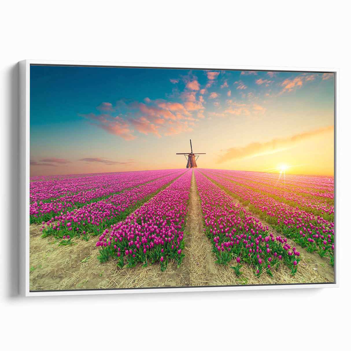 Framed canvas wall art showcasing a serene landscape with windmills against a vibrant sunset, perfect for enhancing home decor with a touch of nature.