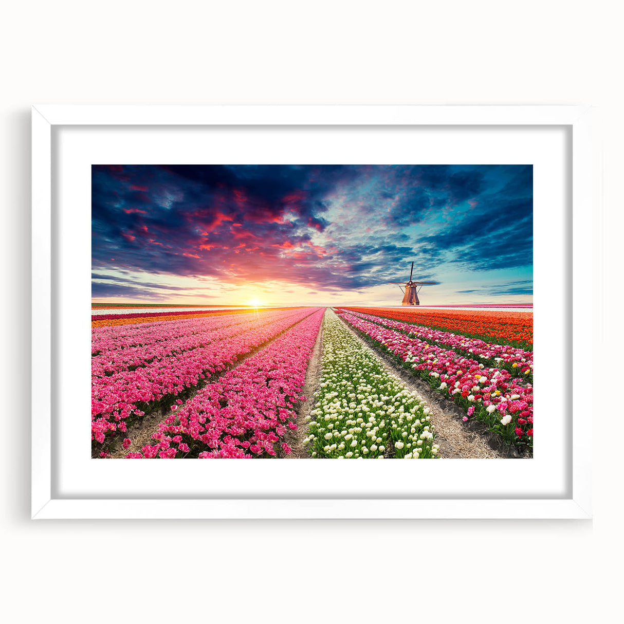 Framed wall art showcasing a picturesque landscape with windmills, presented in a white mat frame, ideal for home decor and enhancing interior aesthetics.