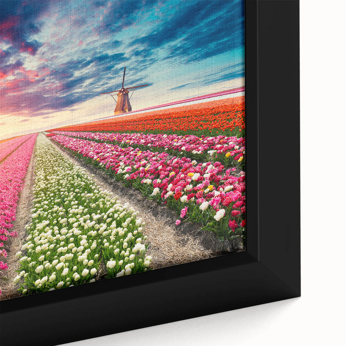 Framed canvas wall art showcasing a picturesque landscape with windmills, highlighting vibrant colors and intricate details, perfect for home decor enhancement.