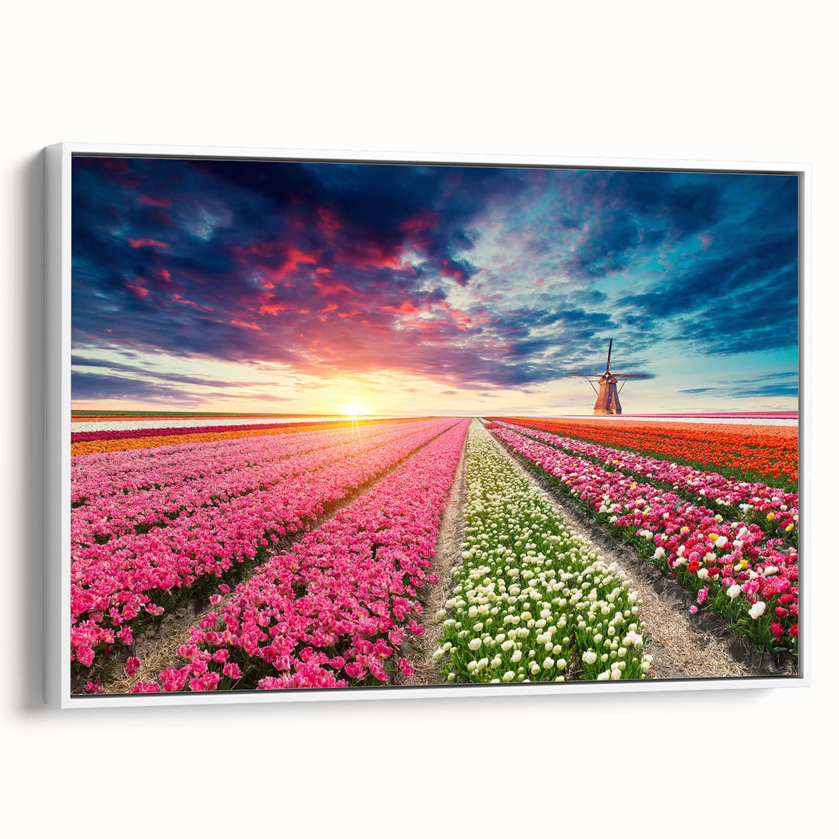 Framed canvas wall art showcasing a picturesque landscape with windmills against a vibrant sunset, enhanced by a sleek white frame, ideal for home decor.
