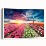 Framed canvas wall art showcasing a picturesque landscape with windmills against a vibrant sunset, enhanced by a sleek white frame, ideal for home decor.