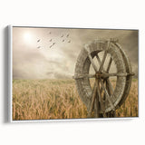 Framed canvas wall art showcasing a serene landscape with windmills against a vibrant sunset, featuring a white frame that enhances the artwork's modern aesthetic.