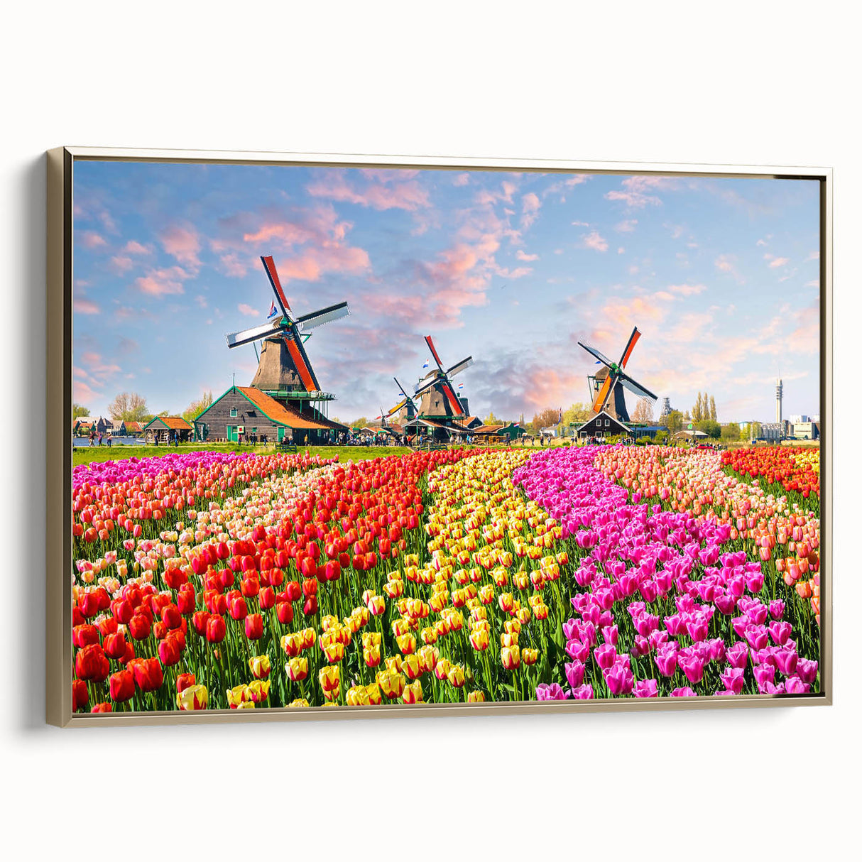 Framed canvas artwork showcasing a serene landscape with windmills, highlighted by a gold frame. Ideal for home decor, evoking calmness and nature's beauty.