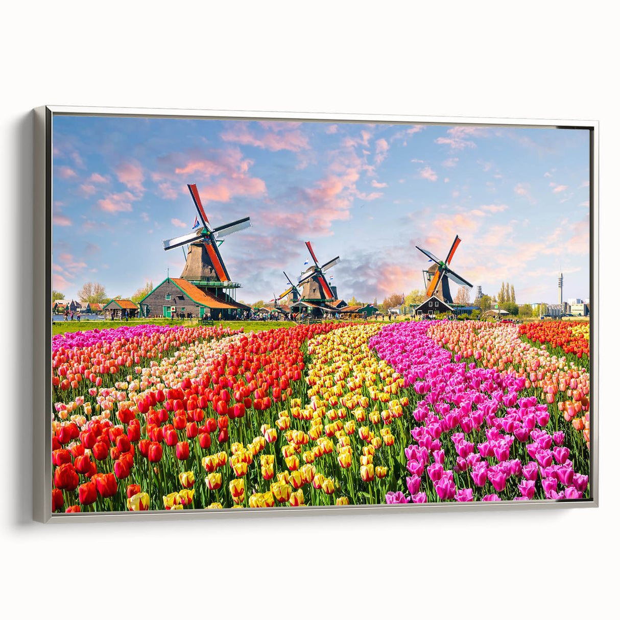 Framed canvas wall art showcasing a serene landscape with windmills, featuring a silver frame, perfect for adding elegance to home decor. Ideal for nature lovers and modern interiors.