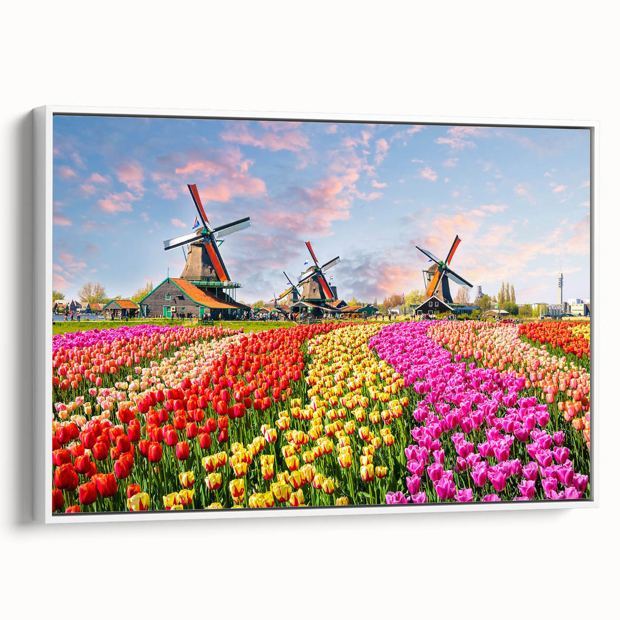 Framed canvas wall art showcasing a serene landscape with windmills against a blue sky, featuring vibrant colors and a modern design, perfect for home decor.