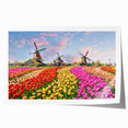 Rolled print showcasing a serene landscape with windmills against a vibrant sunset, ideal for home decor. Perfect for adding a touch of tranquility to any space.