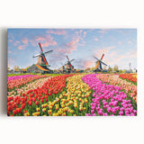 Stretched canvas wall art collection showcasing a serene landscape with windmills, featuring vibrant colors and a tranquil blue sky, ideal for home decor.