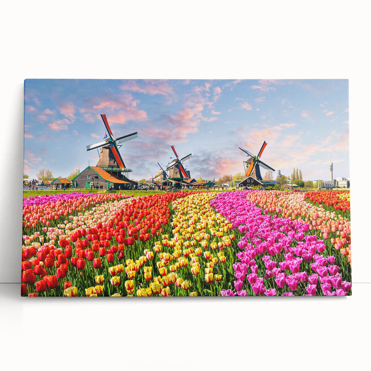 Stretched canvas wall art showcasing a serene landscape with windmills amidst rolling hills, presented in a modern design, perfect for home decor.