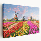 Stretched canvas wall art featuring a serene landscape with windmills against a clear blue sky, perfect for home decor. Ideal for nature lovers seeking tranquility.