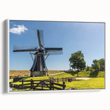 Framed canvas wall art featuring a serene landscape with windmills, showcasing soft pastel colors and a tranquil atmosphere, perfect for home decor.