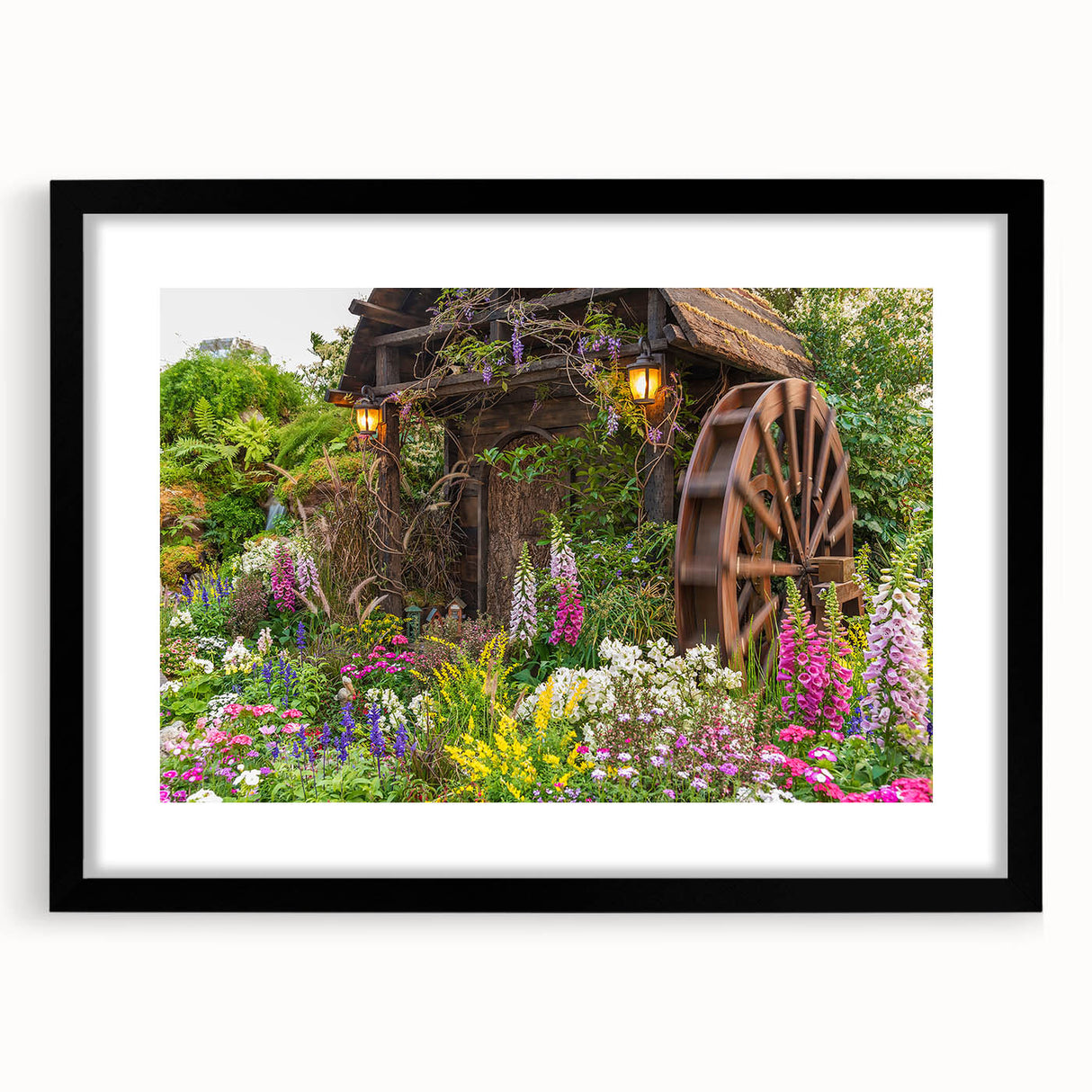 Black-framed wall art print showcasing a serene landscape with windmills, perfect for home decor. The artwork is elegantly matted, enhancing its visual appeal.