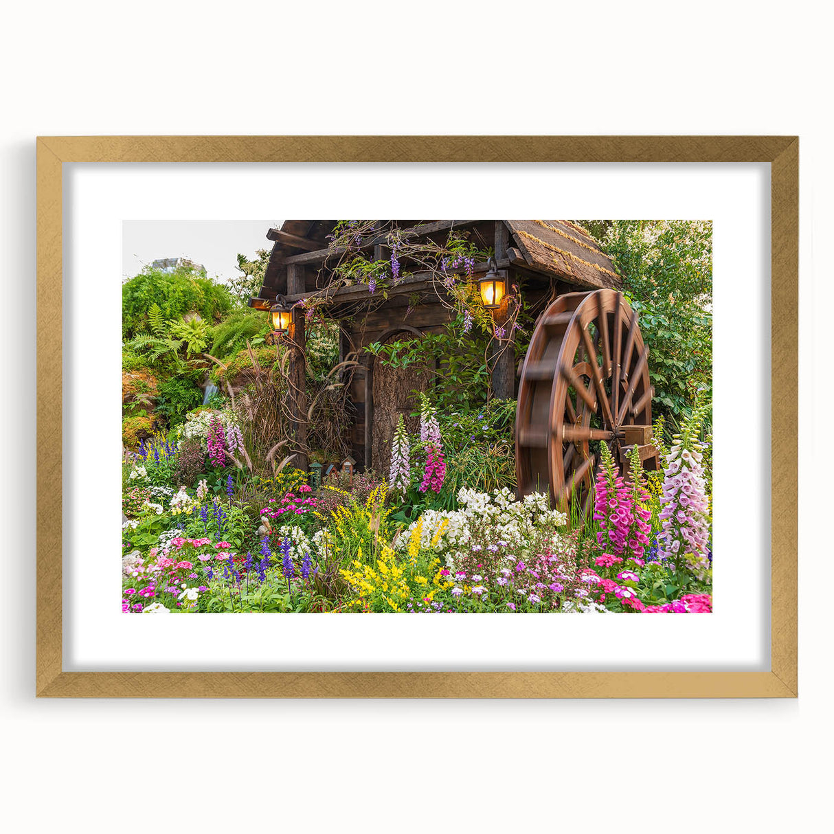 Gold-framed wall art featuring a serene landscape with windmills, showcasing vibrant colors and intricate details, perfect for home decor and enhancing interiors.