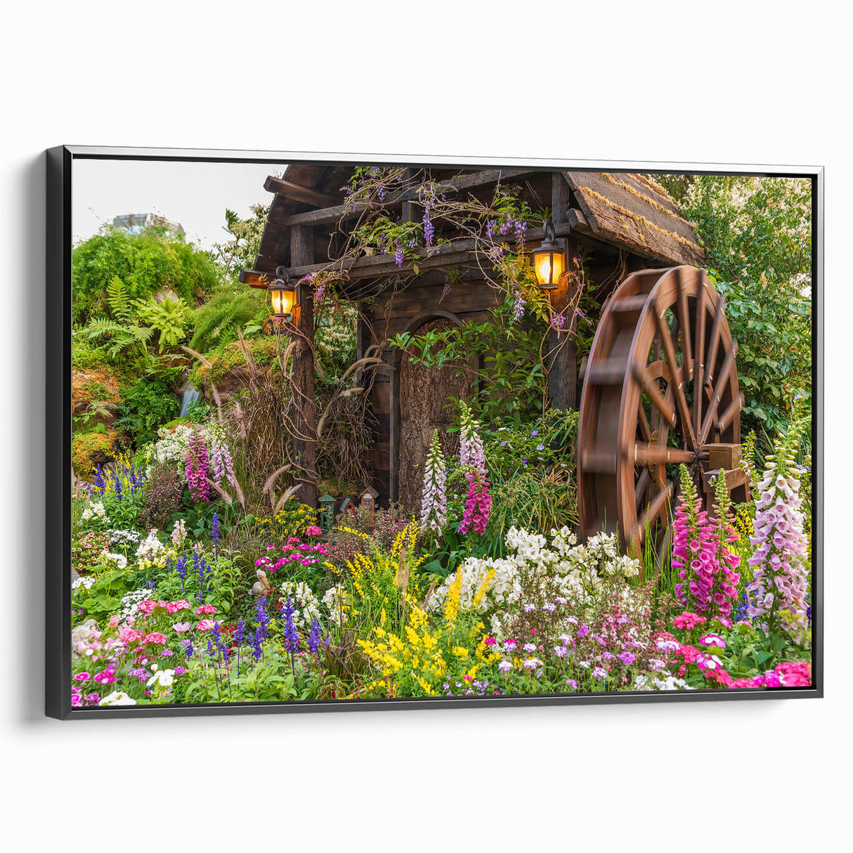 Framed canvas wall art showcasing a serene landscape with windmills, featuring a black frame and vibrant colors, perfect for home decor or office ambiance.