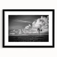 Framed wall art featuring a picturesque landscape with windmills, set against a vibrant sunset, showcasing a black frame and mat, ideal for home decor.