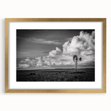 Framed wall art featuring a scenic landscape with windmills, presented in a gold frame with a mat, ideal for home decor and enhancing interior spaces.