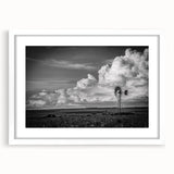Framed wall art showcasing a serene landscape with windmills, featuring a white mat and elegant design, perfect for home decor and enhancing interior aesthetics.