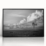 Framed wall art featuring a scenic landscape with windmills, designed in a modern acrylic style. The black frame enhances the vibrant colors, ideal for contemporary home decor.