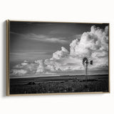 Framed canvas wall art featuring a picturesque landscape with windmills, set against a vibrant sunset sky, showcasing rich colors and intricate details, perfect for home decor.