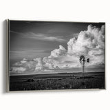 Framed canvas wall art featuring a serene landscape with windmills, presented in a sleek silver frame, ideal for enhancing home decor with a calming touch.