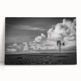 Stretched canvas wall art featuring a vibrant landscape of windmills amidst rolling hills, showcasing a serene sunset with warm hues, perfect for home decor.