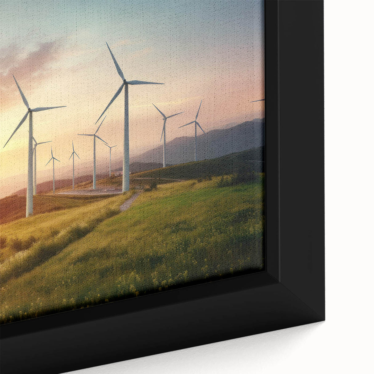 Framed canvas wall art showcasing a vibrant landscape with windmills amidst rolling hills, highlighting rich colors and intricate details for home decor.