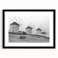 Framed wall art collection featuring a serene windmill landscape design, with a black frame and mat enhancing the visual appeal. Ideal for home decor.