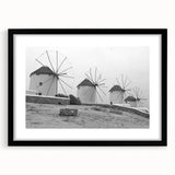 Framed wall art collection featuring a serene windmill landscape design, with a black frame and mat enhancing the visual appeal. Ideal for home decor.