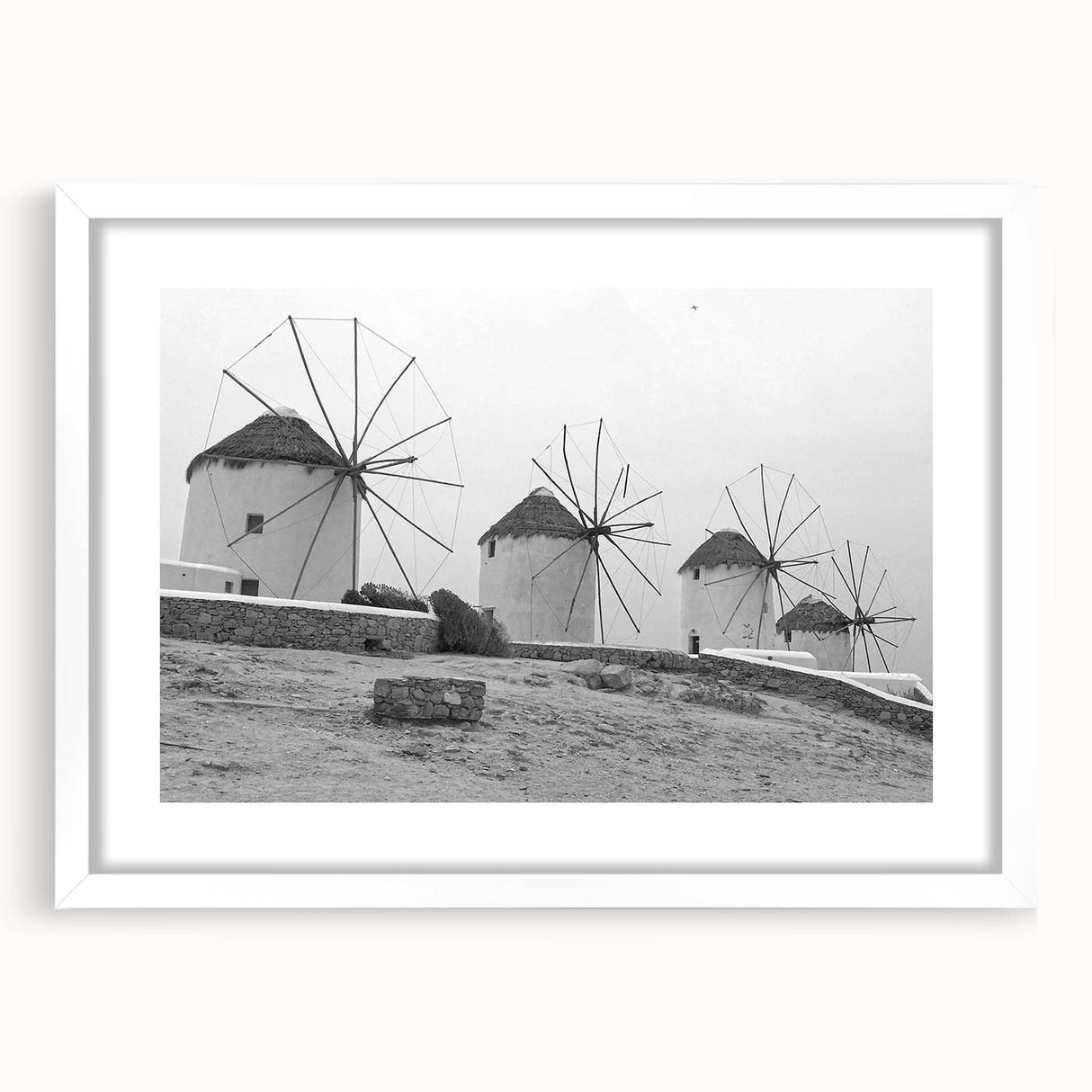 Framed landscape wall art featuring a serene windmill scene, with a white mat border, perfect for home decor or office settings, enhancing any wall space.