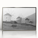 Framed wall art featuring a serene landscape with windmills, presented in a sleek silver frame, ideal for enhancing home decor. Perfect for nature lovers.