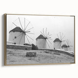 Framed canvas wall art depicting a serene landscape with windmills, featuring a gold frame and side view. Perfect for enhancing home decor with nature-inspired elegance.
