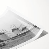 Colorful rolled print of a windmill landscape, showcasing vibrant skies and fields, perfect for home or office decoration. Packaged securely for delivery.