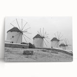 Stretched canvas artwork showcasing a serene landscape with windmills, featuring soft pastel colors and a tranquil sky, perfect for home decor enhancement.