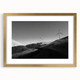 Framed wall art collection showcasing a serene landscape with windmills, featuring a gold mat and sleek frame, perfect for home décor or office settings.