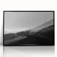 Framed wall art collection showcasing a picturesque landscape with windmills, displayed with a sleek black frame, ideal for enhancing home decor aesthetics.