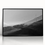 Framed wall art collection showcasing a picturesque landscape with windmills, displayed with a sleek black frame, ideal for enhancing home decor aesthetics.