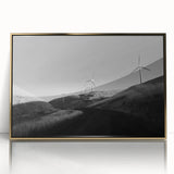 Framed wall art featuring a stunning landscape with windmills, designed in gold accents. The piece showcases a serene rural scene, perfect for home decor.