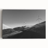 Stretched canvas wall art showcasing a scenic landscape with windmills against a vibrant sunset, perfect for home decor and enhancing interior aesthetics.