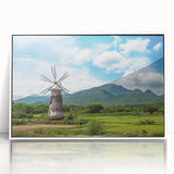 Framed acrylic wall art featuring a serene landscape with windmills, designed to enhance home decor. The artwork showcases a vibrant color palette, ideal for modern interiors.