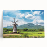 Stretched canvas artwork showcasing a serene landscape with windmills, featuring vibrant colors and intricate details, perfect for home decor or art collection.